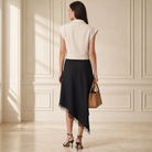 Ecru sleeveless vest with structured shoulders, back view detail