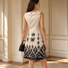 Ikat placement print shift dress back view showing bordered hem detail