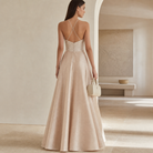 Champagne ball gown with crossover halter straps, back detail view