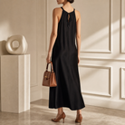 Black halter maxi dress by Lord & Taylor Heritage, back view on model