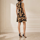 Black mini dress with tan and brown geometric pattern, back detail view