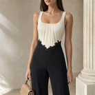 Cream ruched bodice with black lace appliqué waist detail, close-up front view