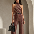 Metallic chevron knit halterneck jumpsuit, close-up of bodice and belt detail
