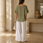 Olive green top showing rounded neckline and tiered sleeve detail by Lord & Taylor Heritage