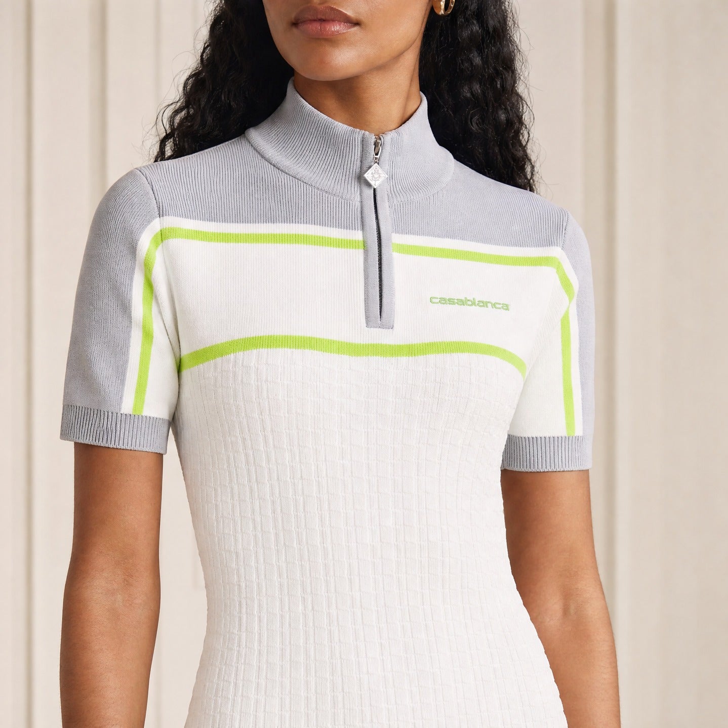 White polo shirt dress front detail showing gray trim and neon yellow piping by Casablanca