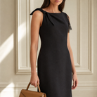 Black midi dress knotted bow shoulder detail and boat neckline, close-up front