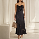 Black satin dress cowl neckline and spaghetti strap detail, close-up front