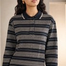 Black and ecru striped polo dress with integrated belt, front detail view