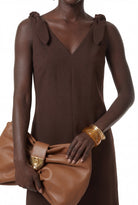 Chocolate brown sleeveless dress with V neckline by Lord & Taylor Heritage, three-quarter view