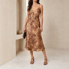 Green animal print midi dress with spaghetti straps by BA&SH, full body front view