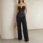 Black satin strapless bustier top with peplum hem by Lord & Taylor Heritage, full-length view