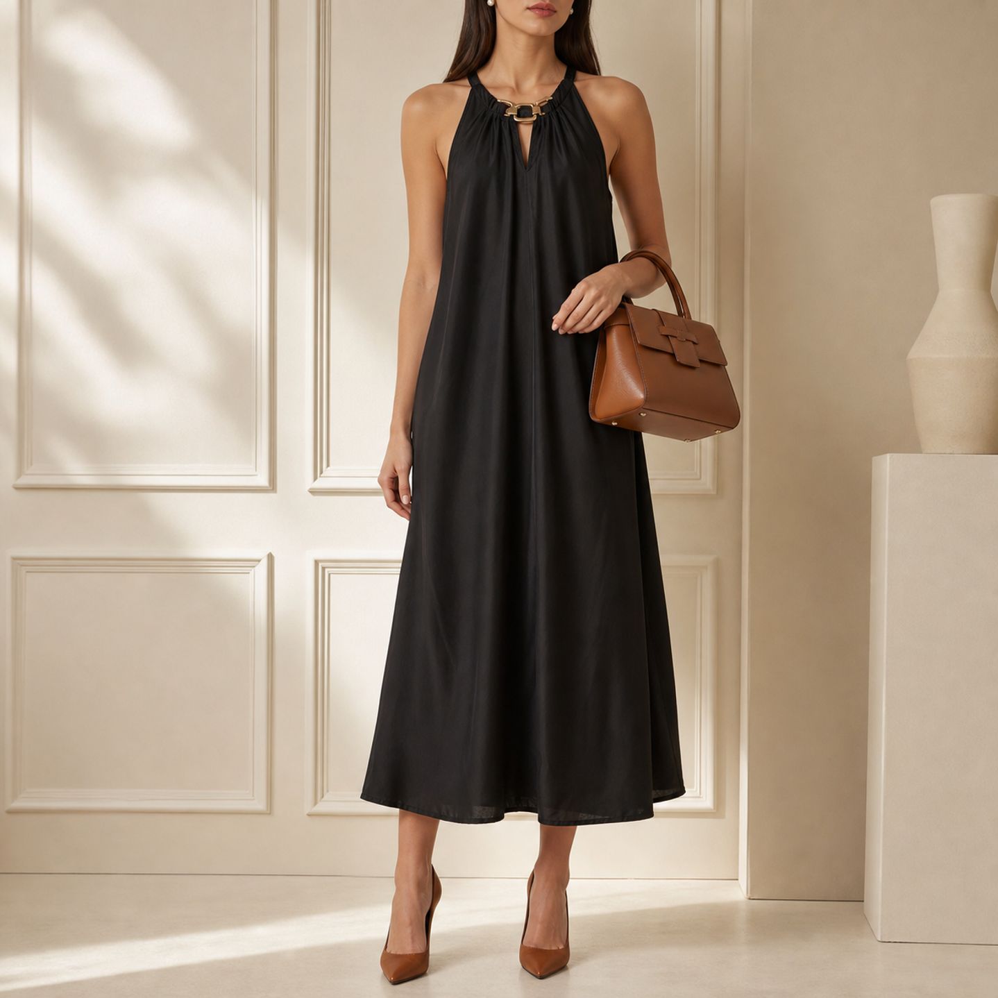 Black halter maxi dress with gold chain neckline by Lord & Taylor Heritage, front view on model