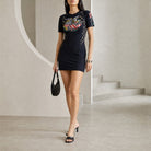 Black Marine Serre fitted mini dress with moon panels, full body view