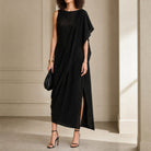 Black PALOMA WOOL sleeveless midi dress with asymmetric drape, full body front view