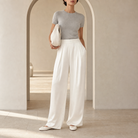 Champagne satin trousers by Lord & Taylor Heritage, full-length three-quarter view on model