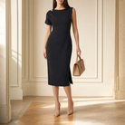 Black asymmetric midi dress with pleated shoulder, full-length front view by Lord & Taylor Heritage