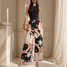 Black multi print palazzo trousers with starburst motifs, back view by Lord & Taylor Heritage