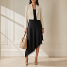 Black satin midi skirt with asymmetric lace hem by Lord & Taylor Heritage, full length on model