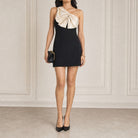 Black Valentino Garavani one-shoulder mini dress with bow detail, full-length view
