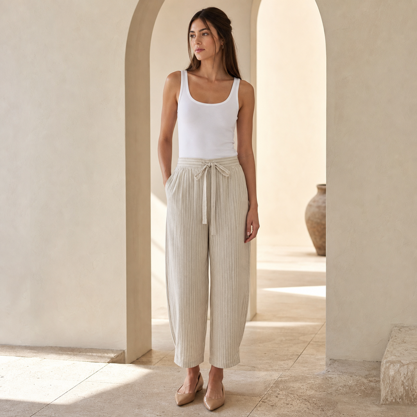 Beige pinstripe wide-leg trousers on model, full length view by Lord & Taylor Heritage