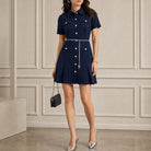 Navy scuba mini dress with pleated skirt by Michael Kors, full body view