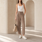 Beige metallic tapered trousers by Lord & Taylor Heritage, full-length front view on model