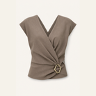 Taupe wrap top with structured shoulders and side buckle, flat product shot