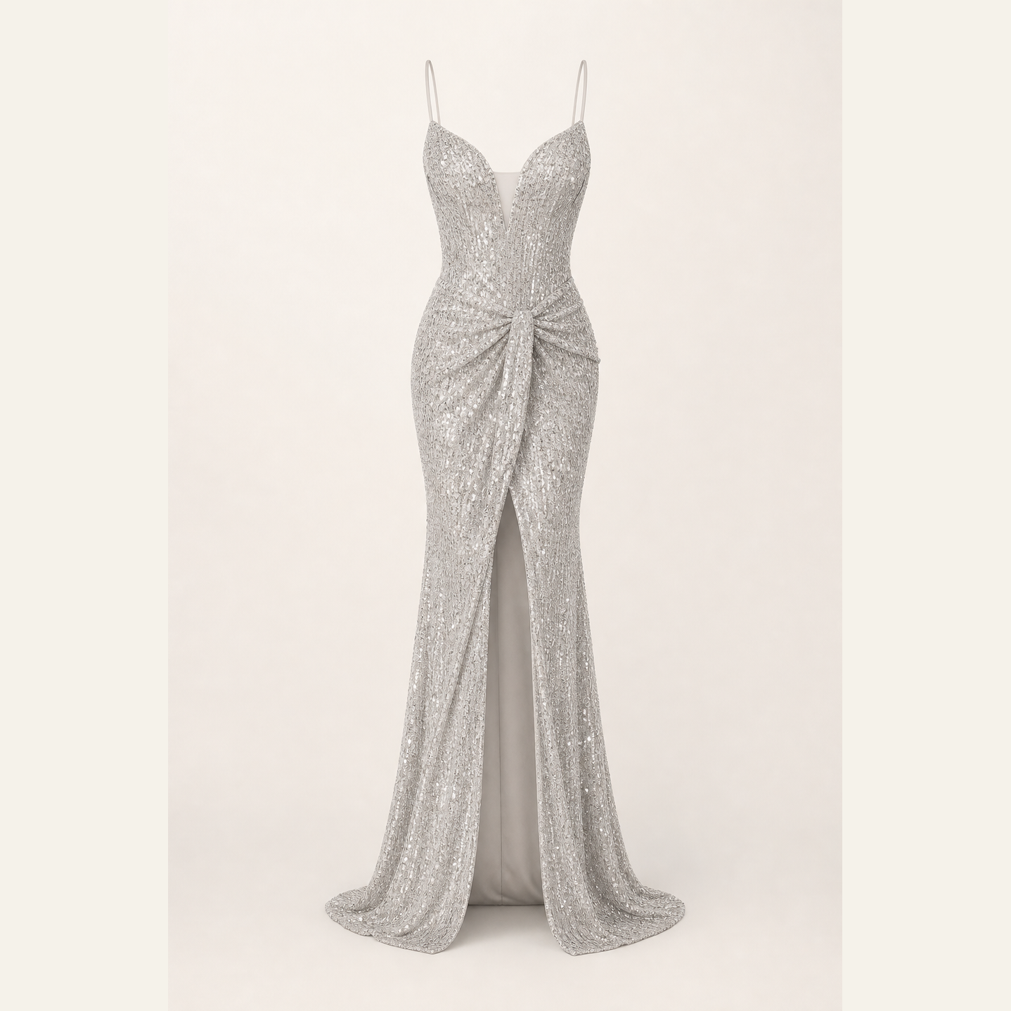 Silver beaded slip gown flat lay showing full-length silhouette and fringe texture