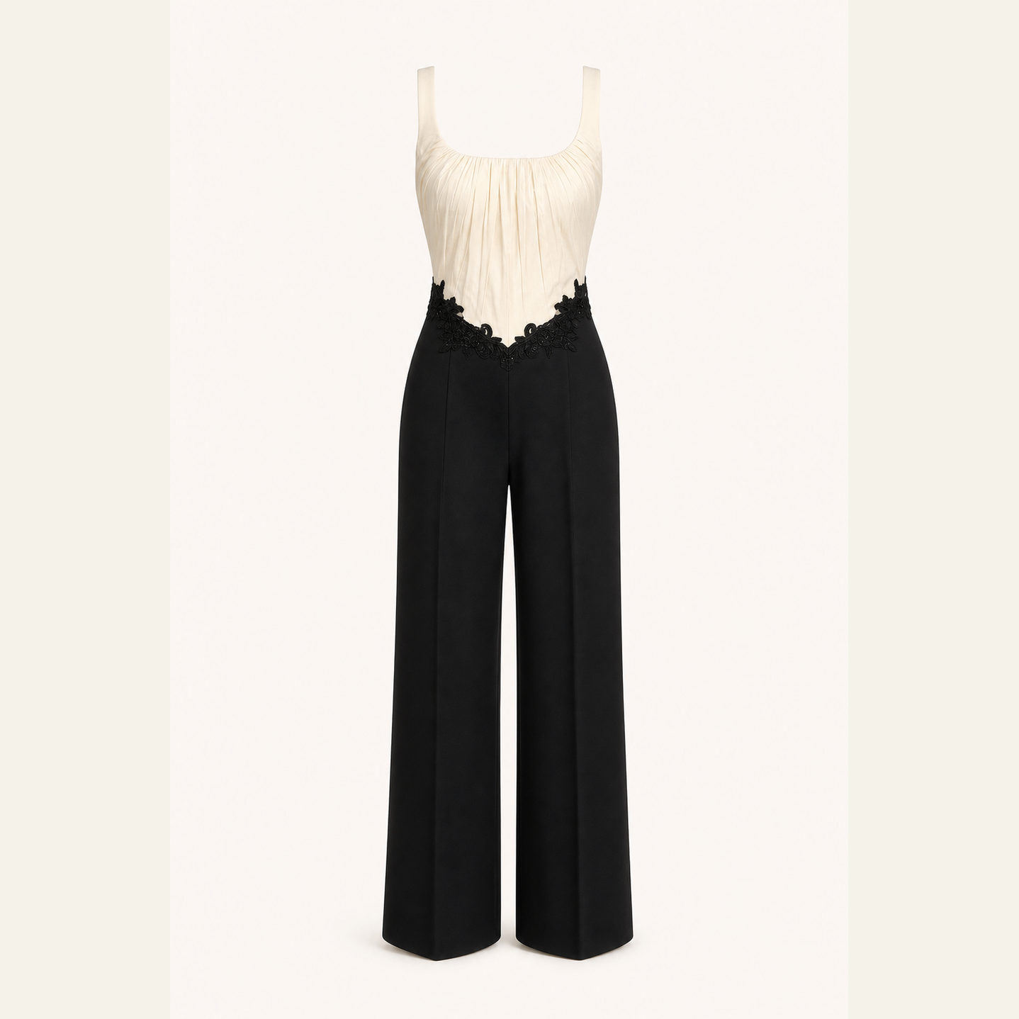 Two-tone jumpsuit with cream bodice and black trousers, flat product shot