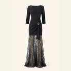 Black lace-overlay gown flat lay showing full silhouette and floral lace overlay