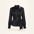 Black satin wrap blouse flat lay product shot by Lord & Taylor Heritage