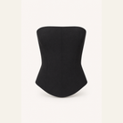 Black corset bustier top flat lay showing construction and seaming