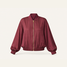 Burgundy satin bomber jacket flat lay product shot by Lord & Taylor Heritage