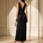 Black metallic maxi gown showing V-neckline and rope-twist waist detail, front close-up