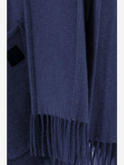 Navy Ferragamo cashmere cape showing fluid drape detail, side angle