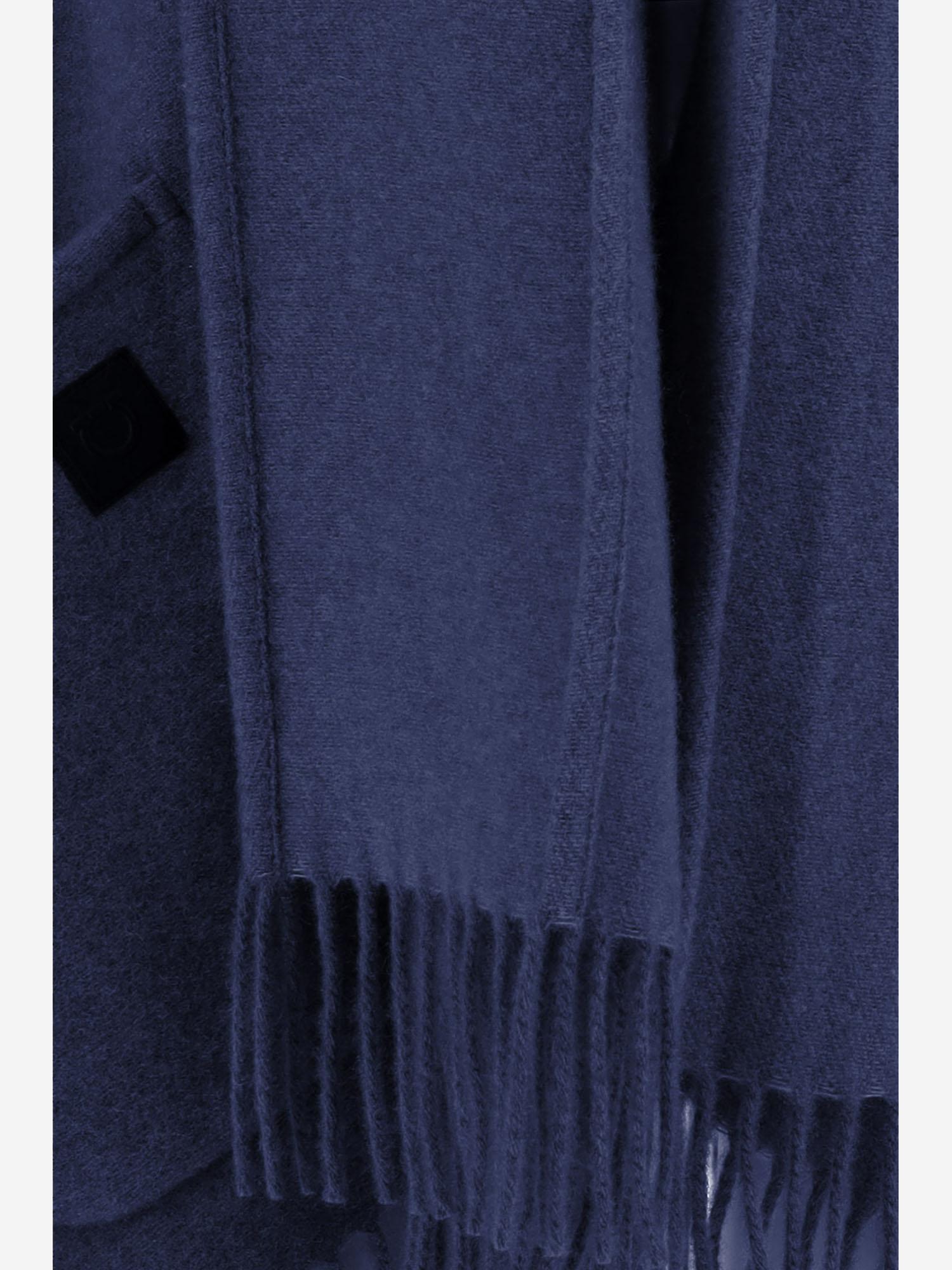 Navy Ferragamo cashmere cape showing fluid drape detail, side angle