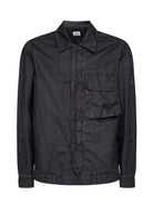Black wax-effect overshirt with Lens detail by C.P. Company, front view