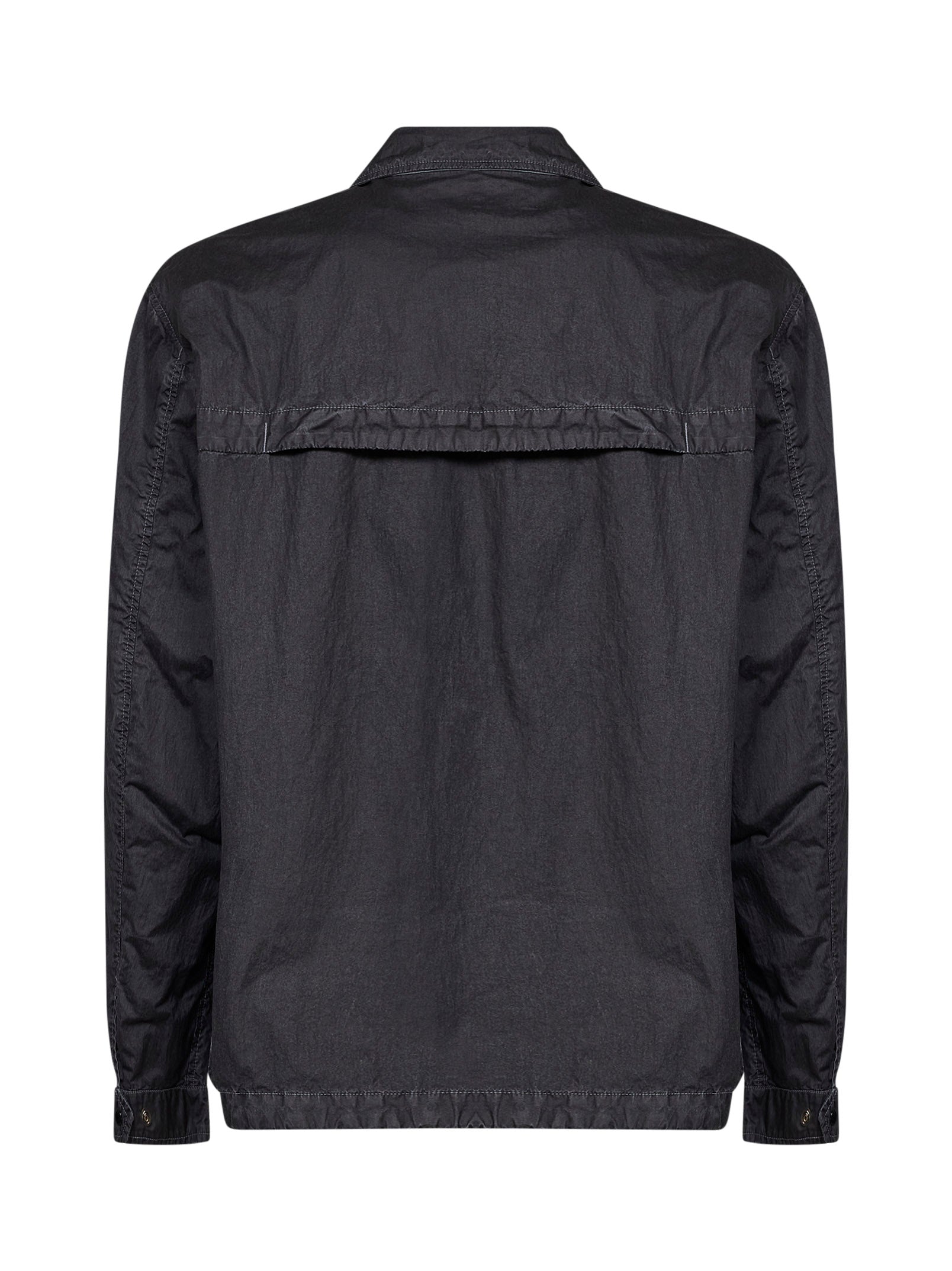 Black C.P. Company overshirt showing chest patch pocket and snap-button placket detail