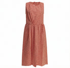 Red checkered sleeveless midi dress by APUNTOB, flat lay view